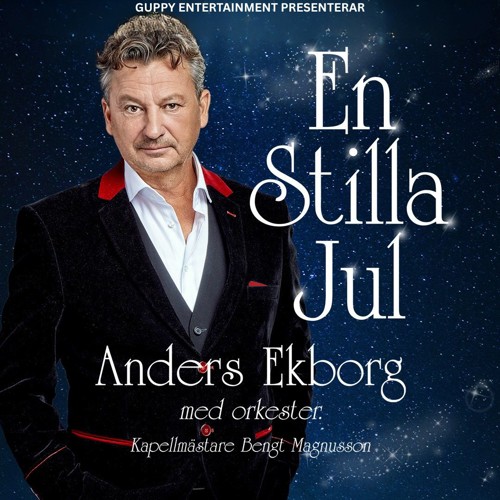 Anders står mot en midnattsblå bakgrund, han ler lite pillemariskt mot er.